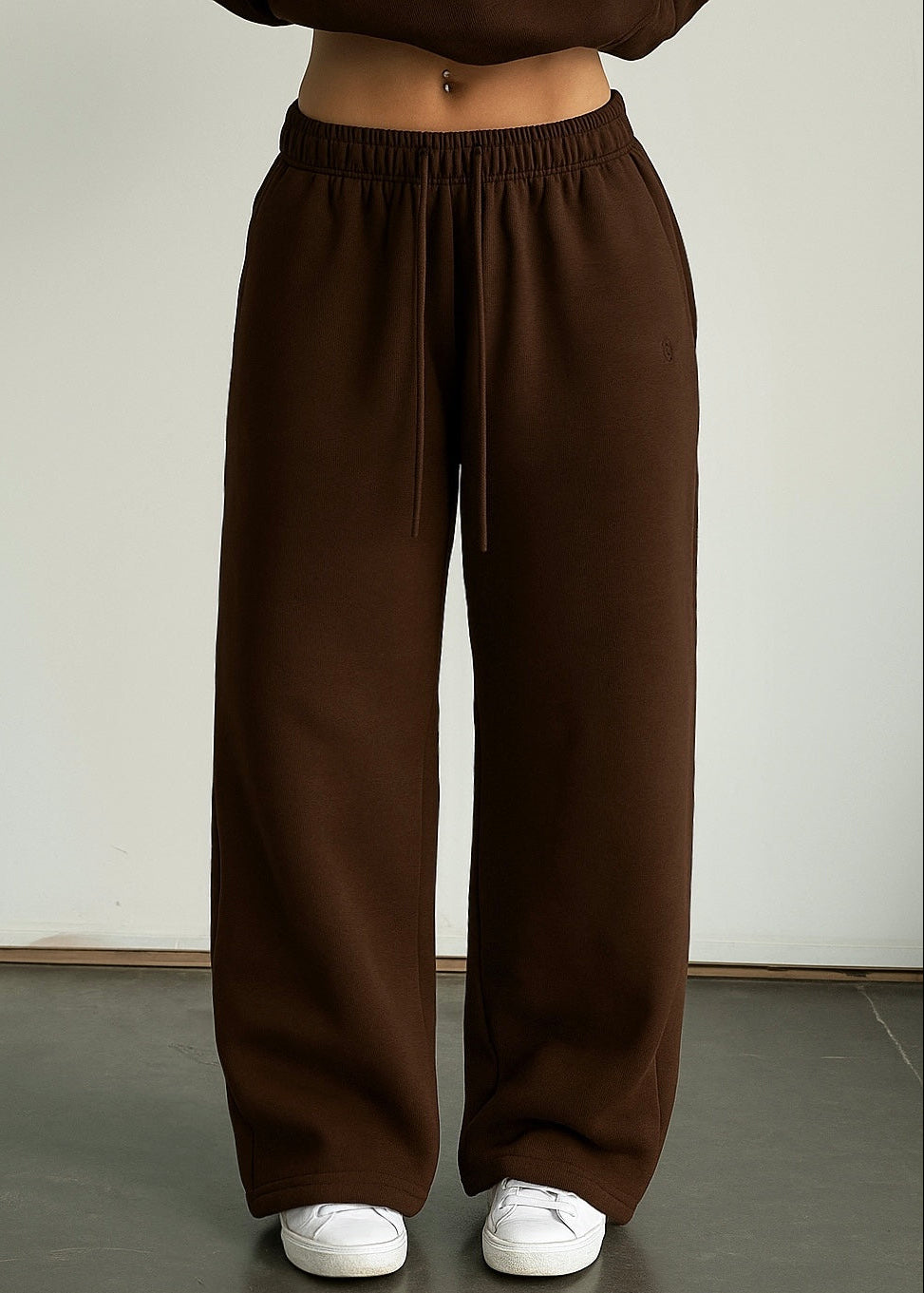 Brown wide-leg pants worn by a person on a plain background